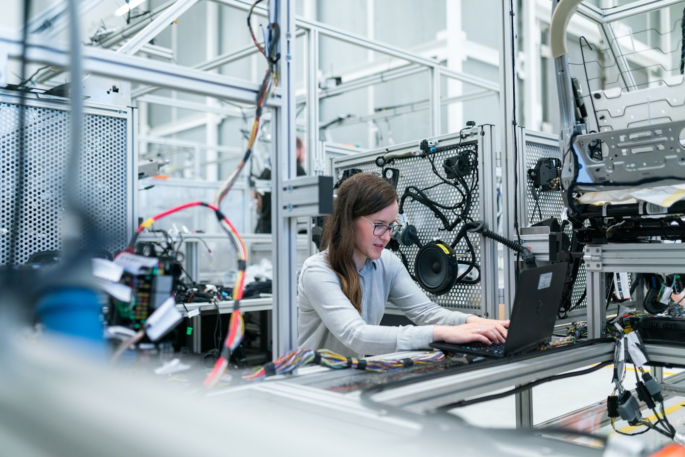 Engineers working in a modern automotive manufacturing plant
